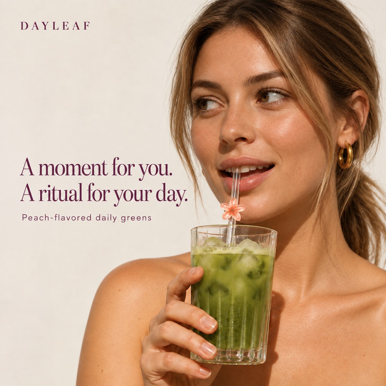 Woman drinking Dayleaf peach greens through a straw